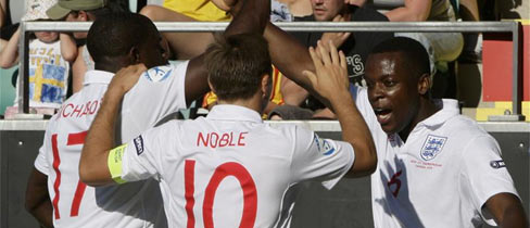 Mark Noble congratulates Nedum Onuoha after the defender notched England's second goal.